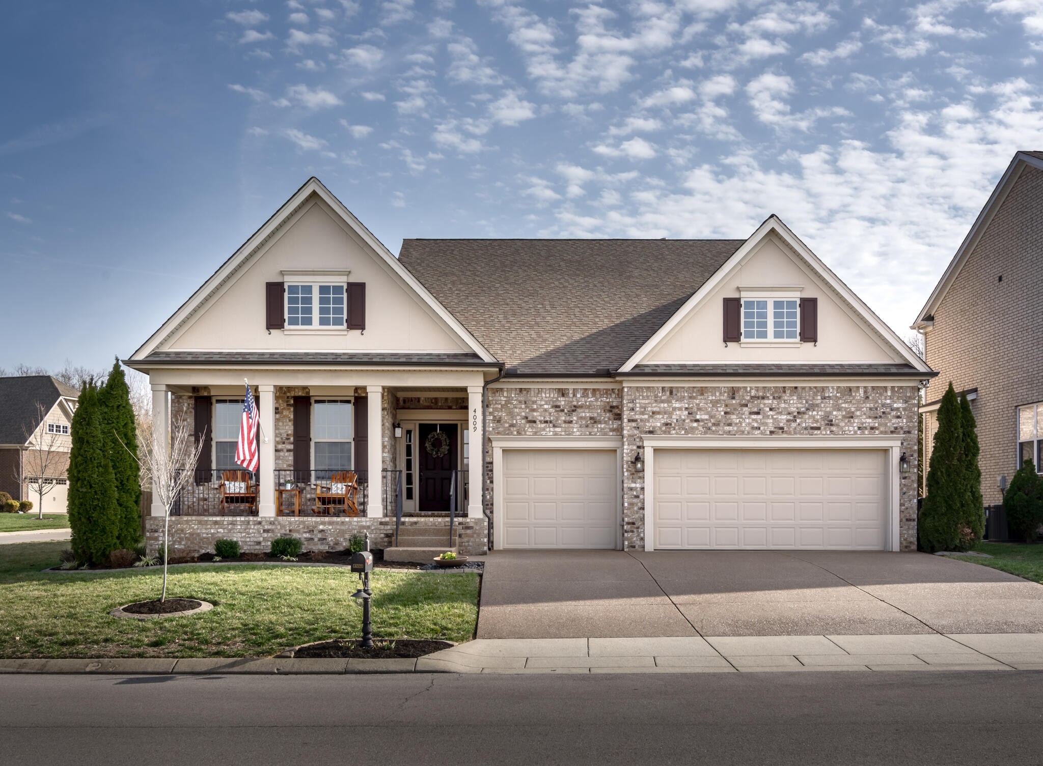 a front view of a house with garage