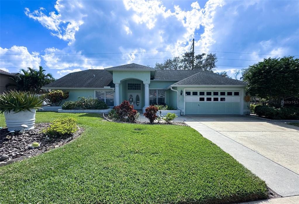 a front view of a house with garden