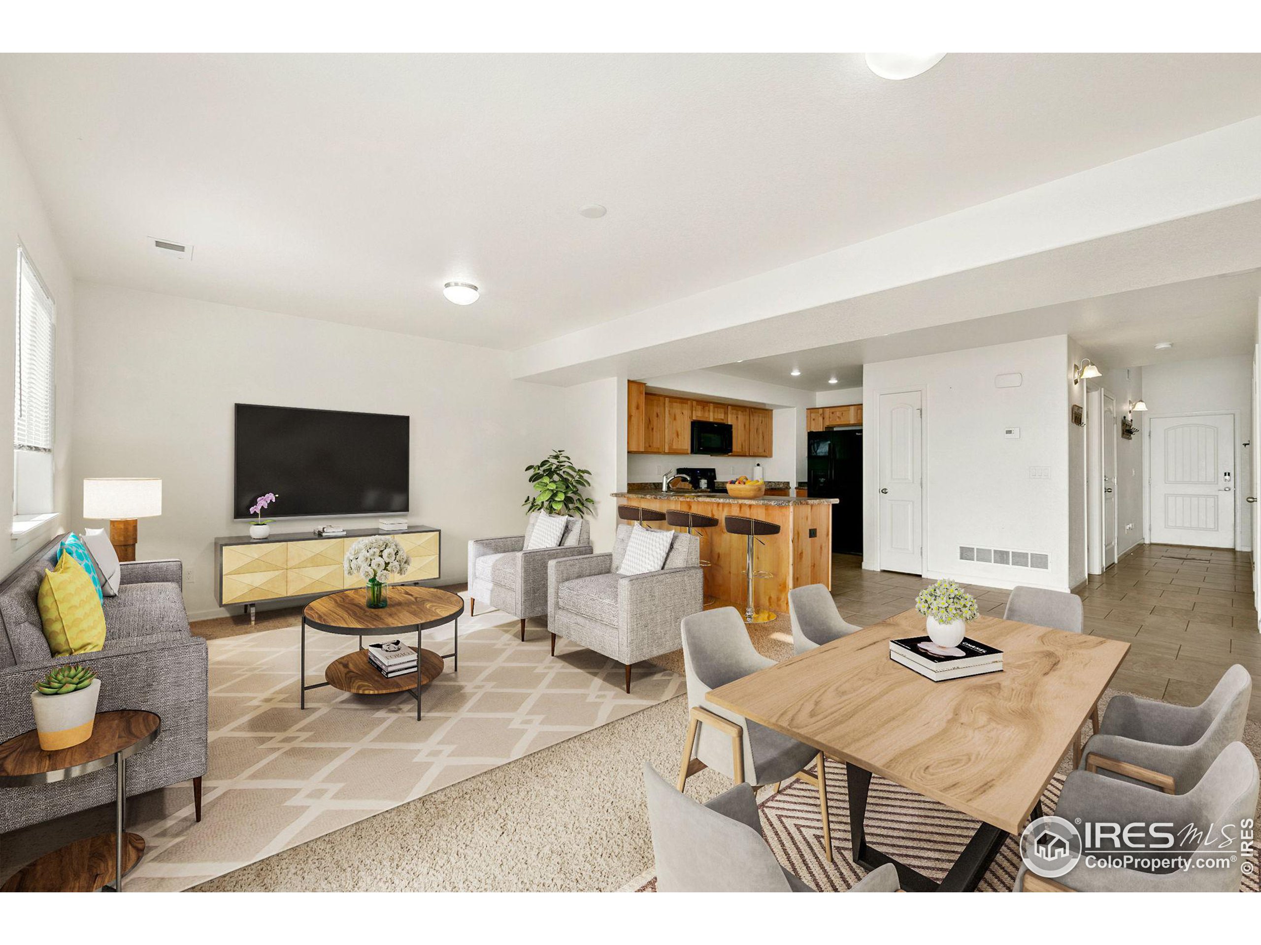 a living room with furniture and flat screen tv