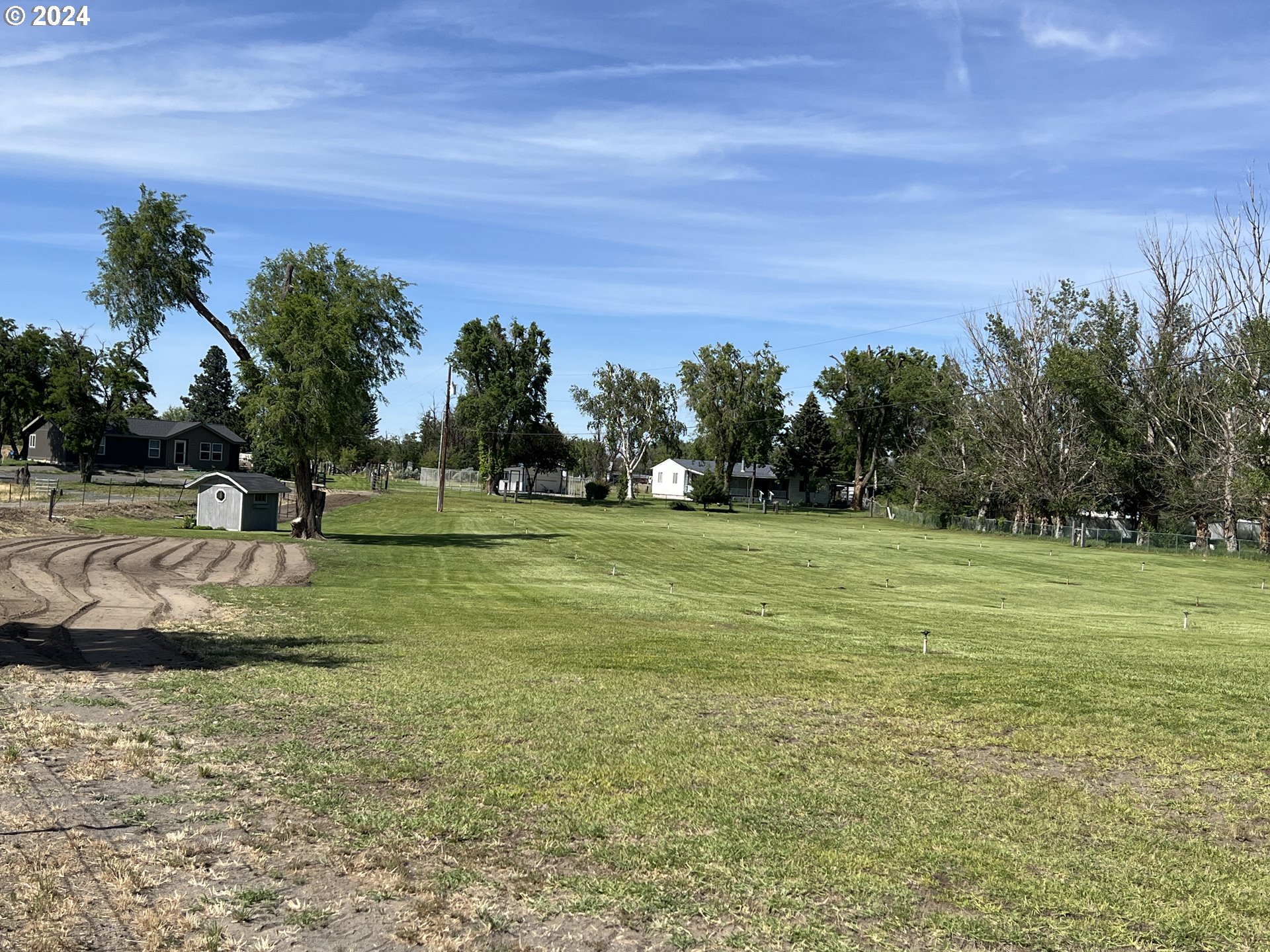 a view of a golf course with a lake