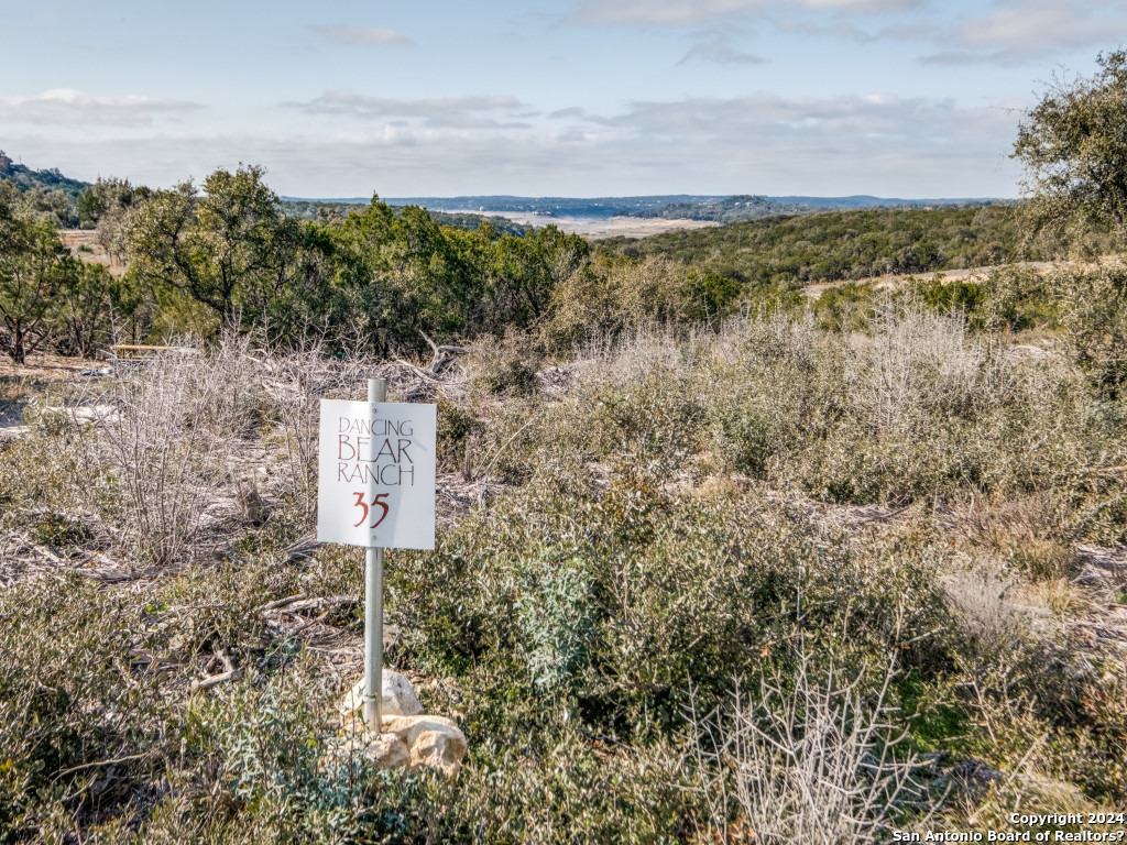 a sign board with pier in back of it