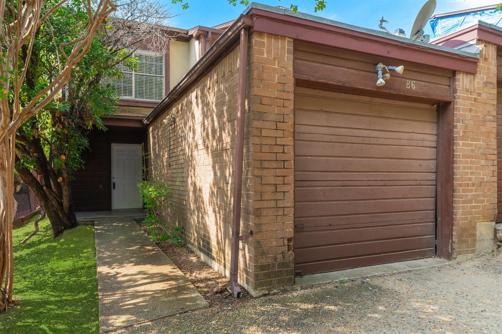 a view of a house with a small yard