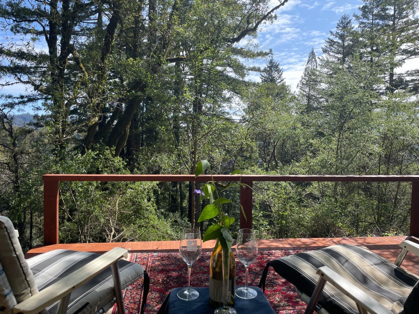 a view of a balcony with two chairs