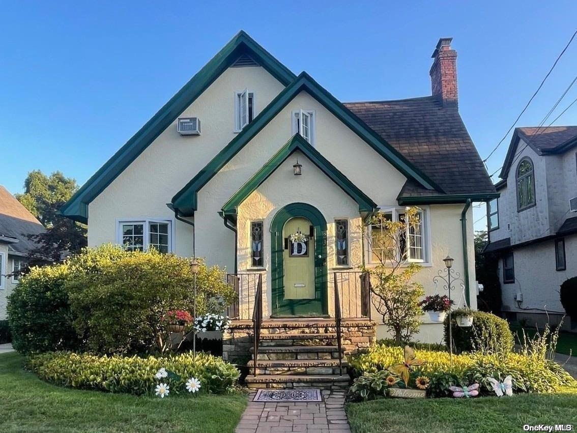 a front view of a house with garden