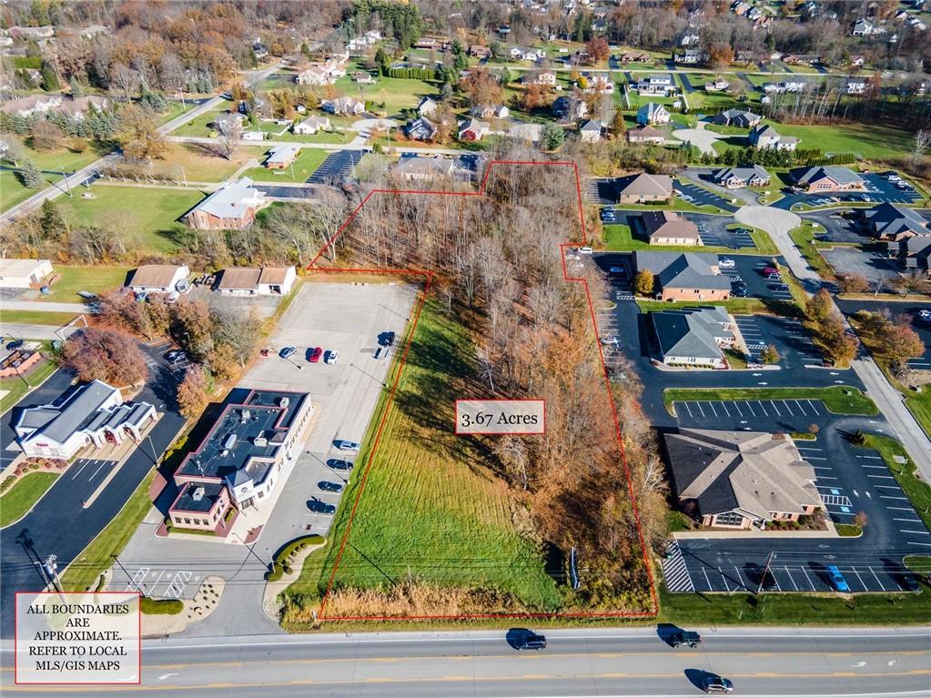 an aerial view of houses with yard