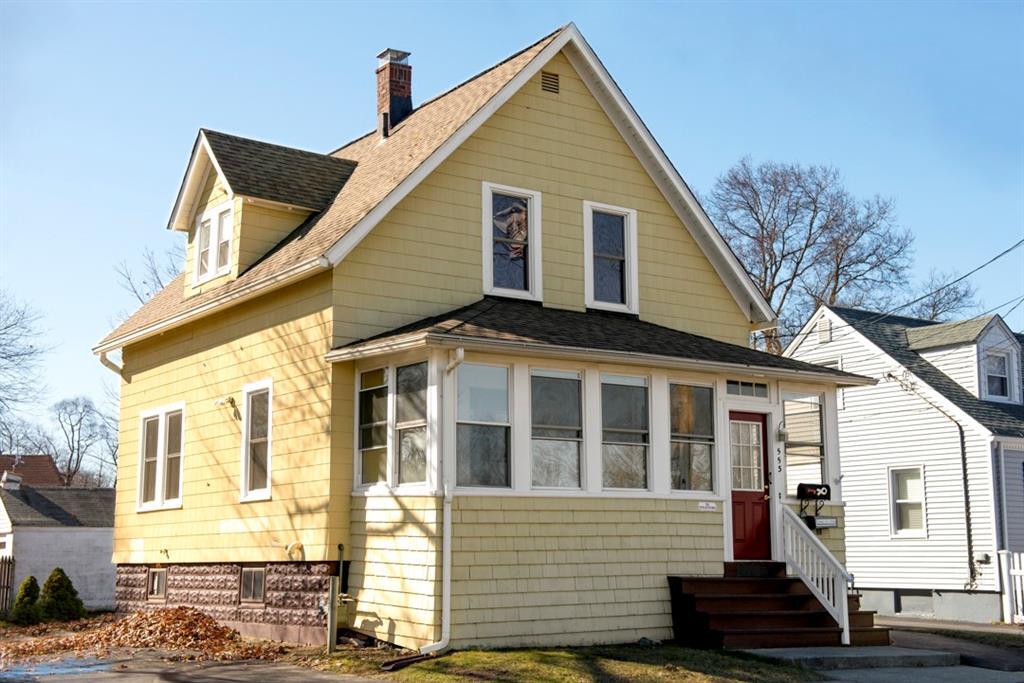 a view of a house with wooden fence