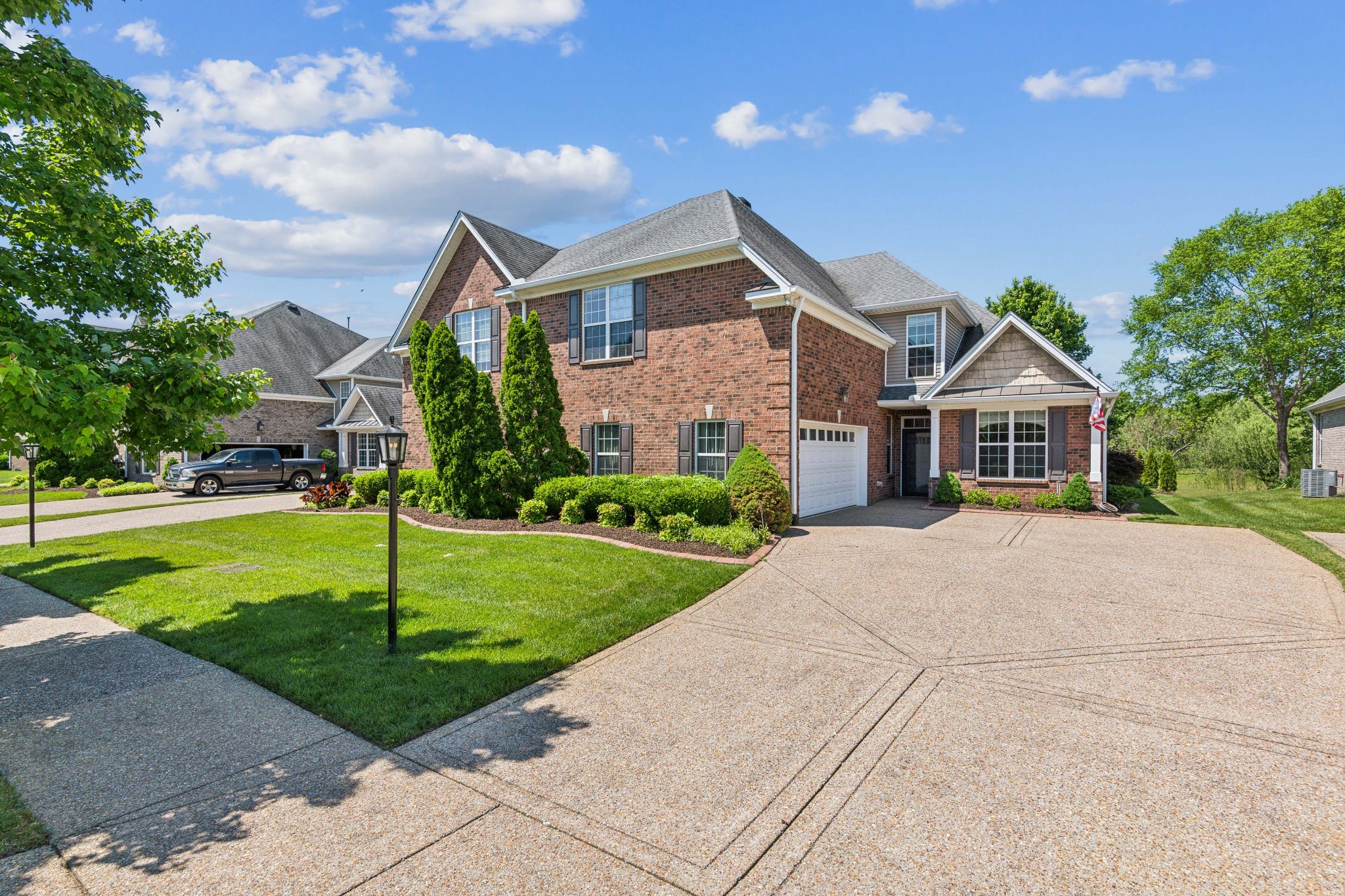 a front view of house with yard and green space