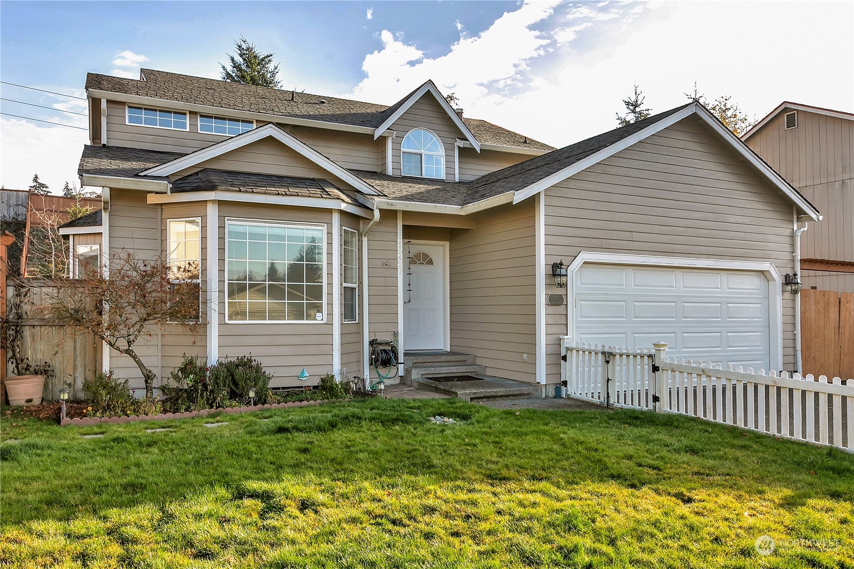 a front view of a house with a yard