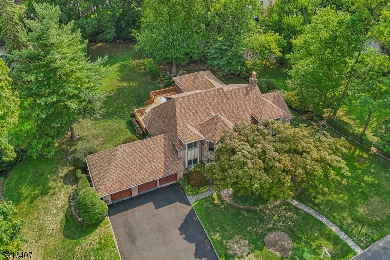 an aerial view of a house with a garden