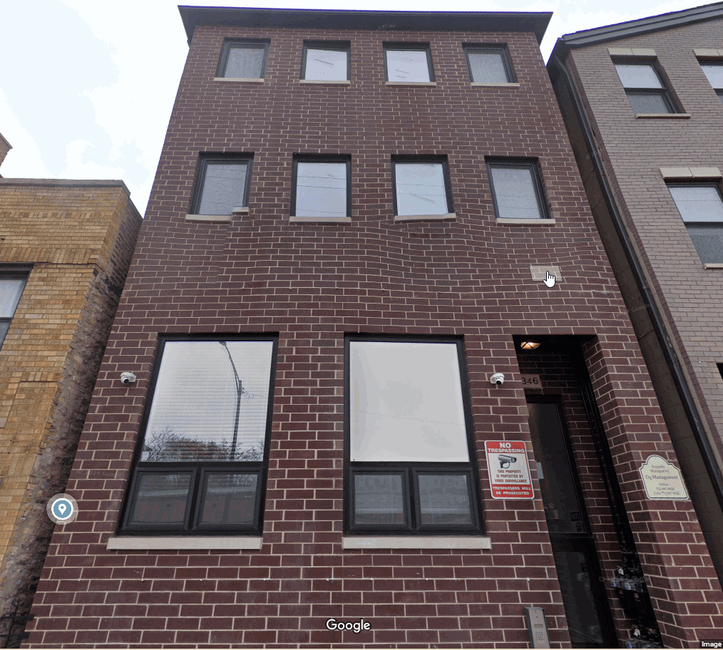 a building view with a brick wall