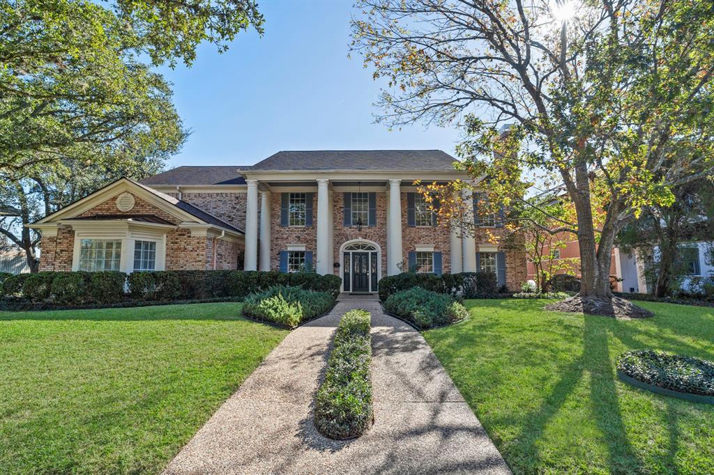 RARE OPPORTUNITY to own one-of-a-kind luxury custom home overlooking lakes and the Sugar Creek Country Club Golf Course.