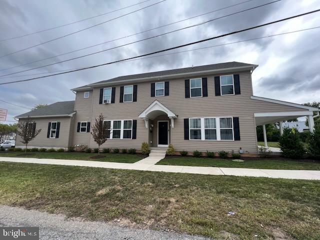 a front view of a house with a yard