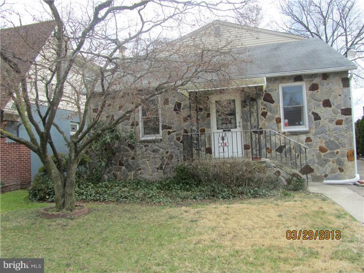 a view of a brick house with large windows