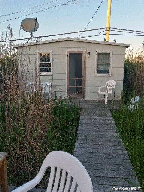 a view of a patio in back of house