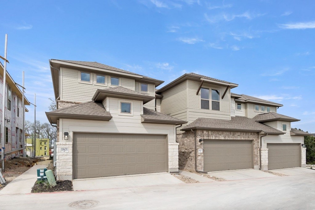 a front view of a house with a garage