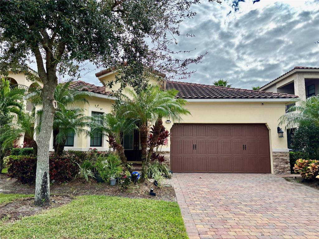 a view of a house with a yard and garage