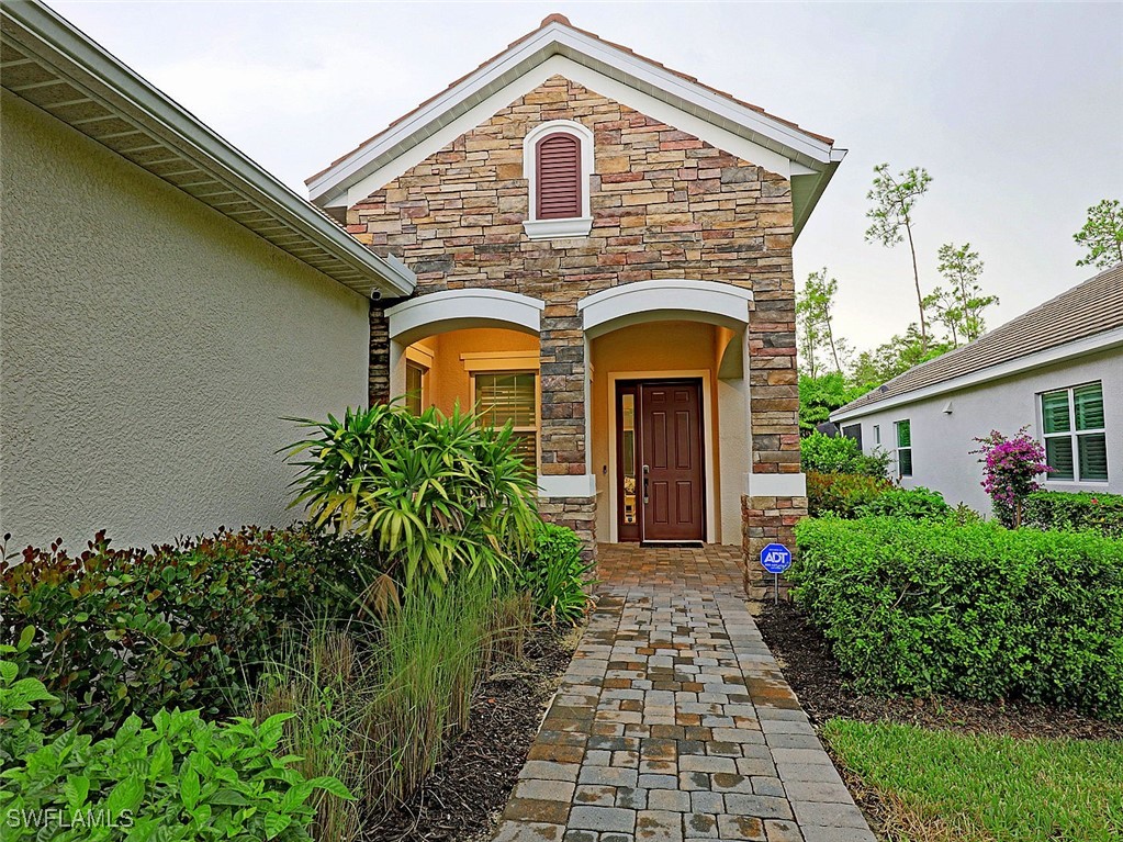 a front view of a house with garden