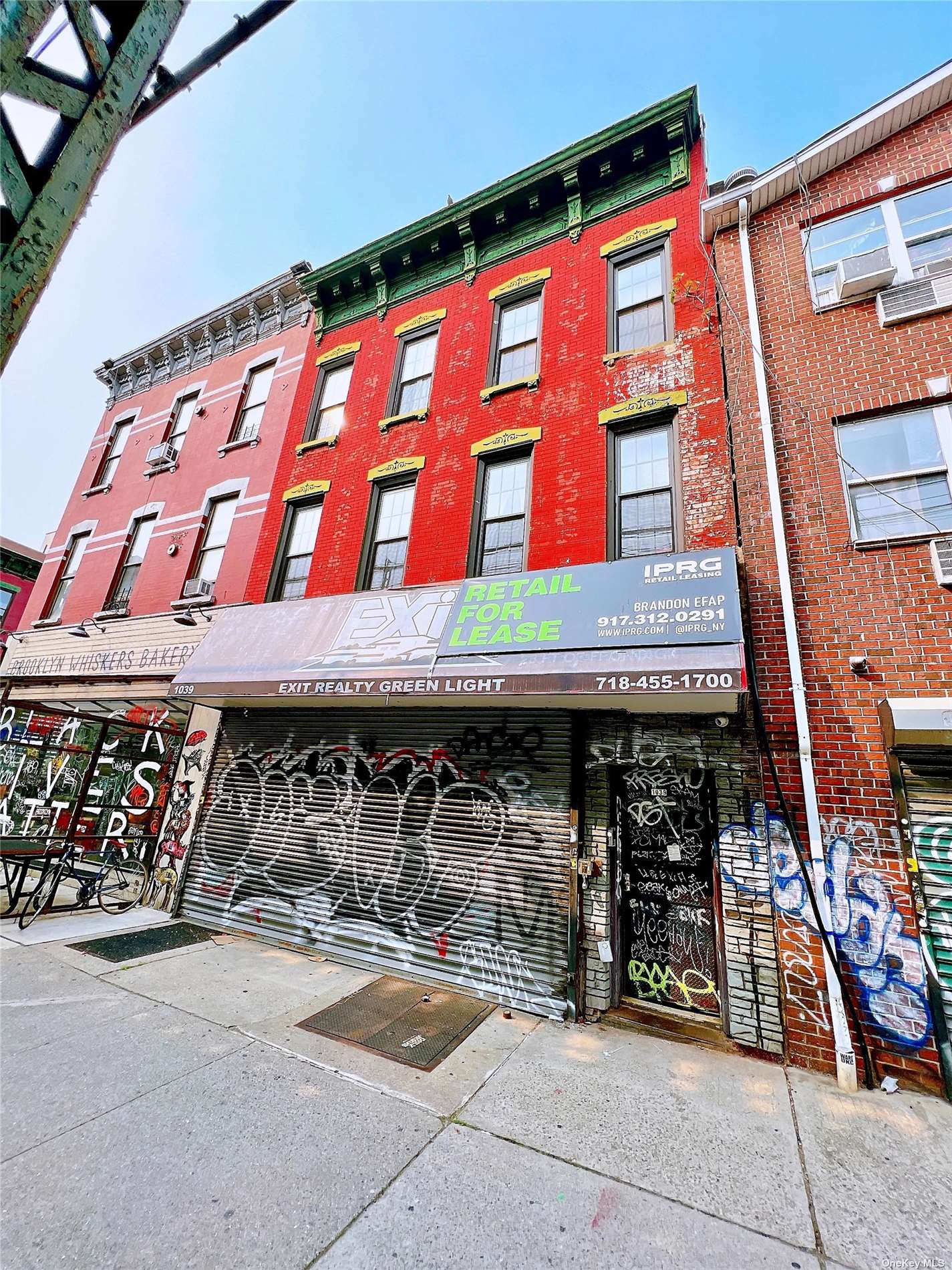 a front view of building with retail shops