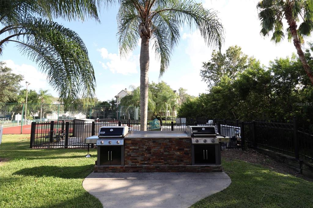 a view of a yard with a table and chairs