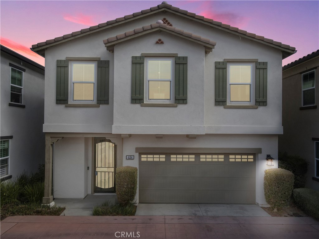 a front view of a house with a garage