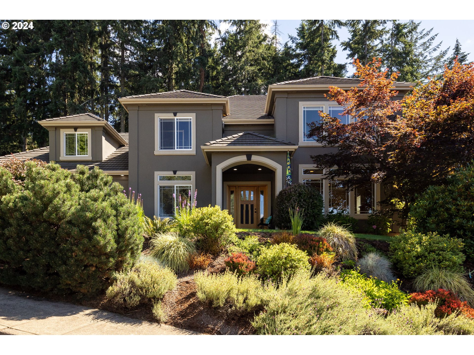 a front view of a house with a yard