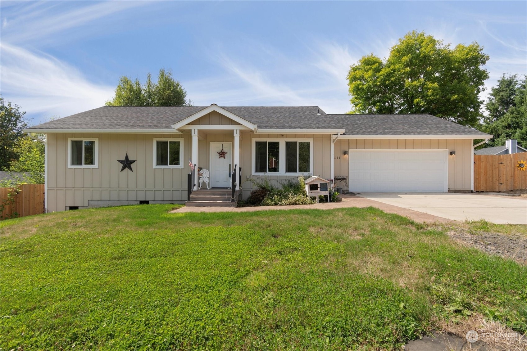 a front view of house with yard and green space