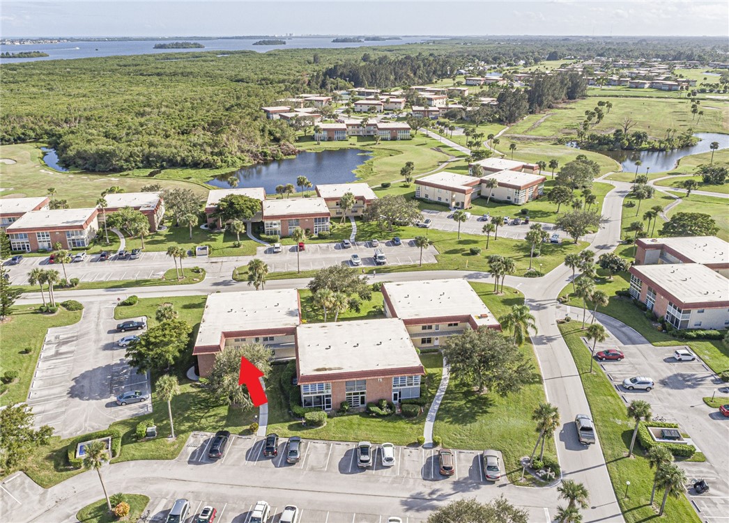 an aerial view of residential building and lake view