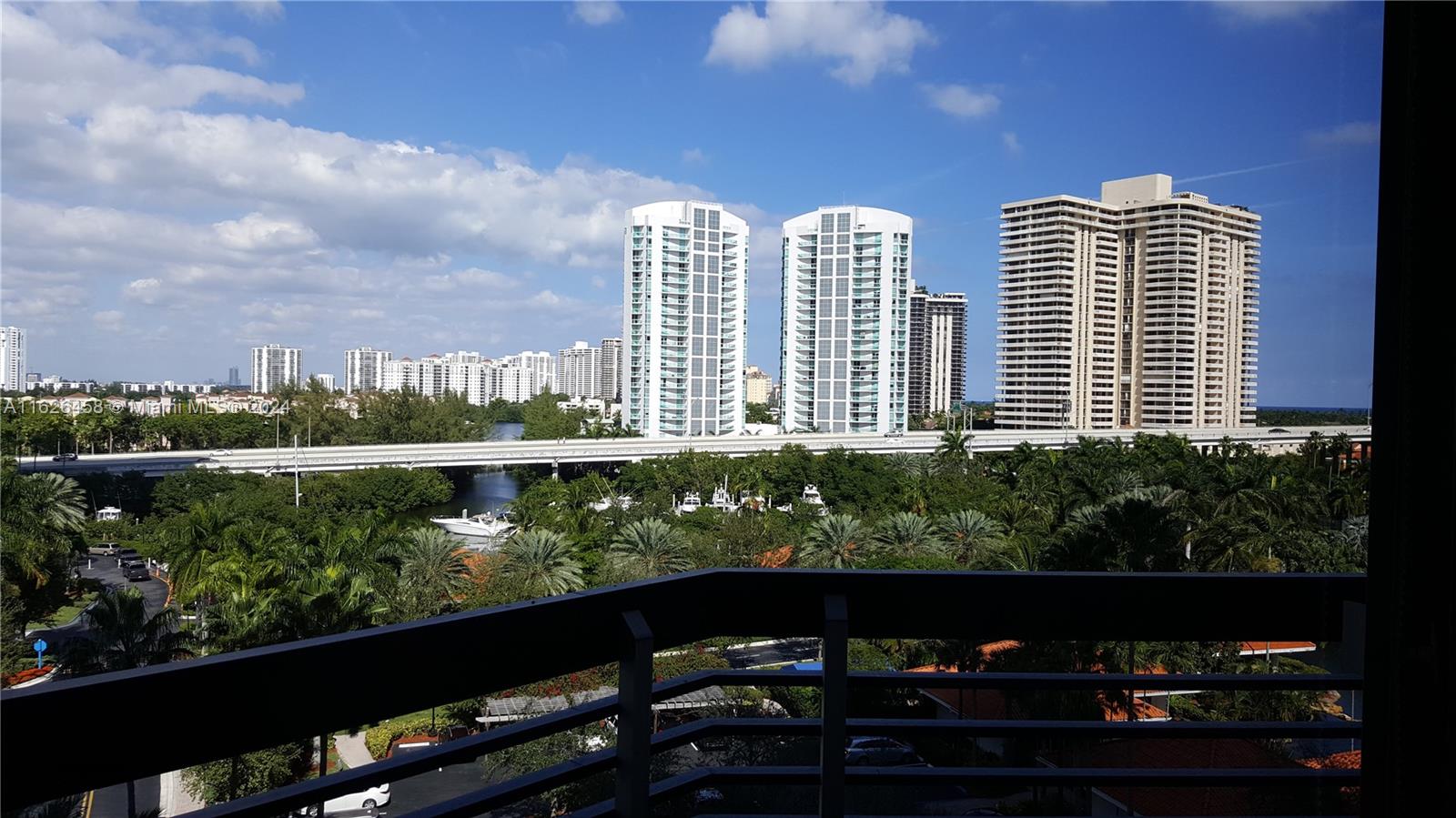 a view of a balcony with two chairs and a table