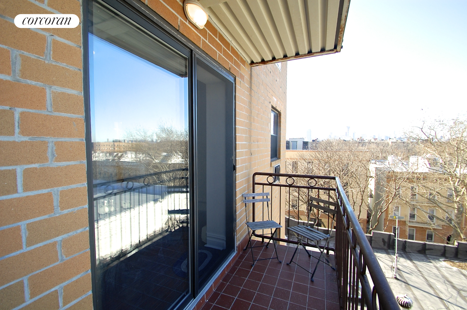 a view of a balcony with furniture