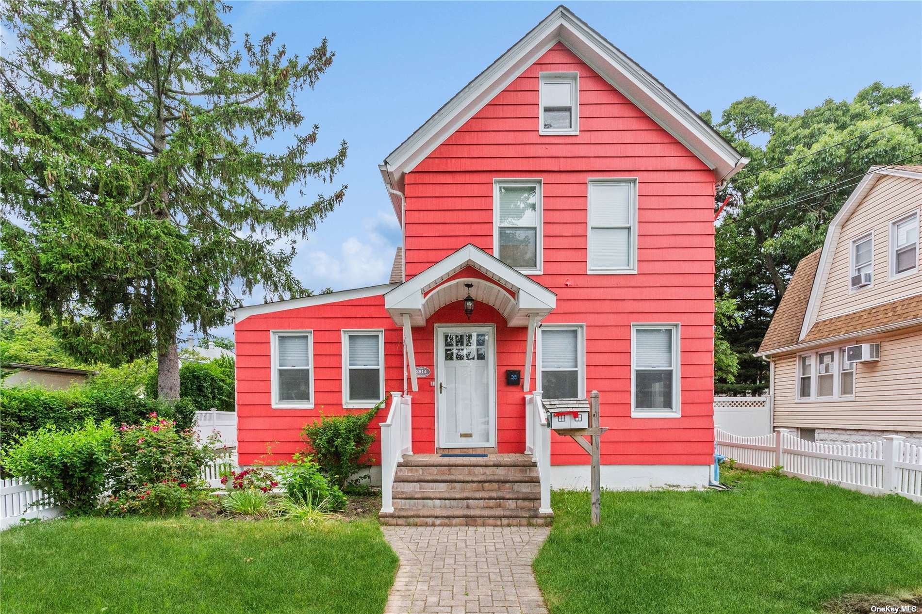 a front view of a house with a yard and porch