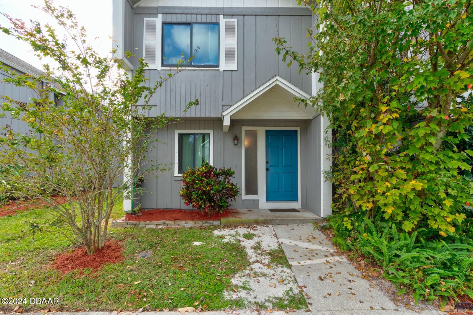 front view of a house with a yard