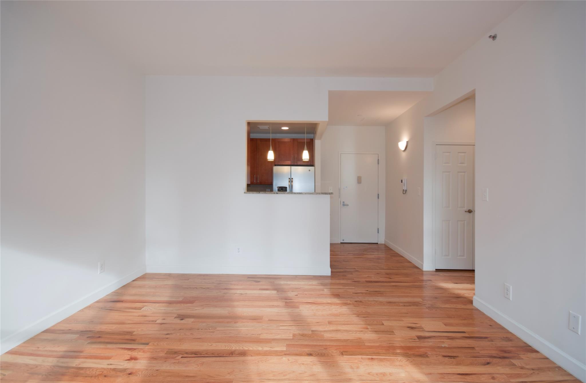 Empty room featuring light wood-type flooring