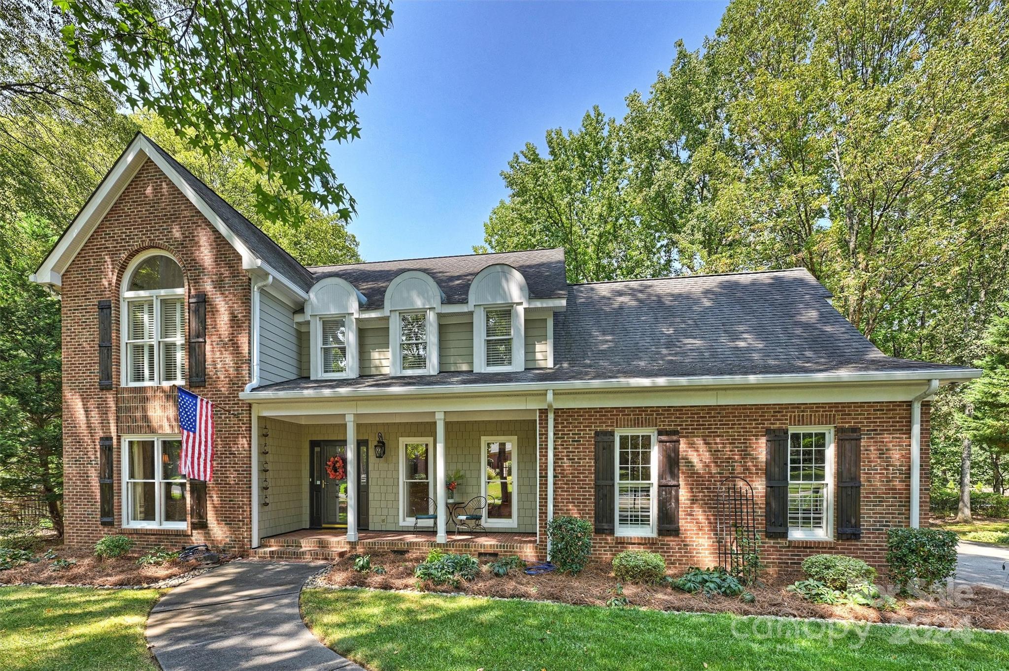 front view of a house with a yard