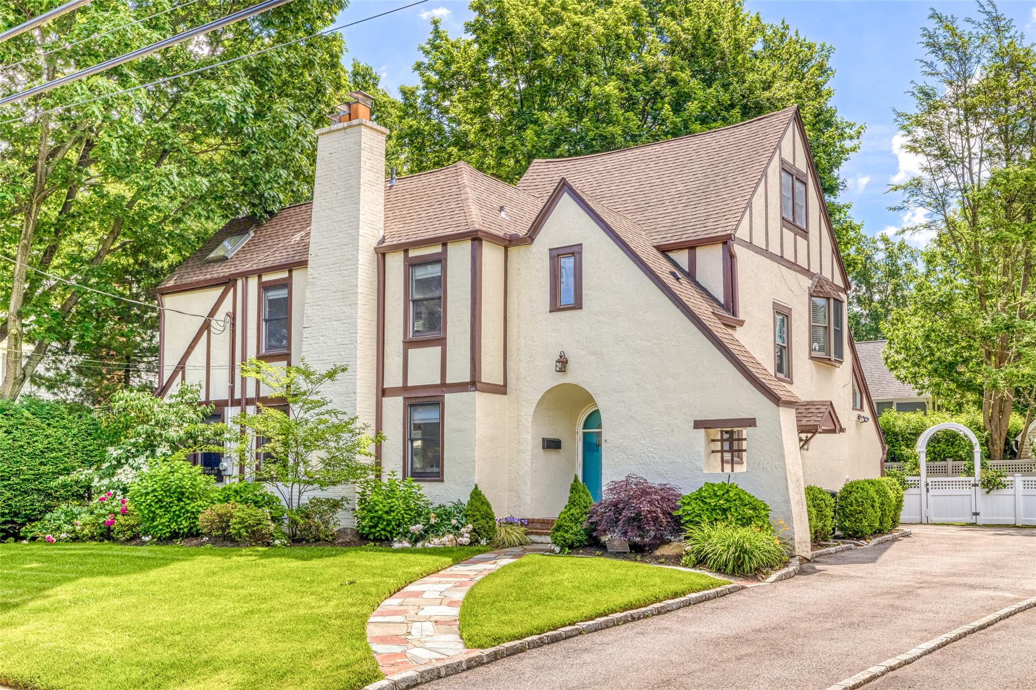 a aerial view of a house with yard and plants