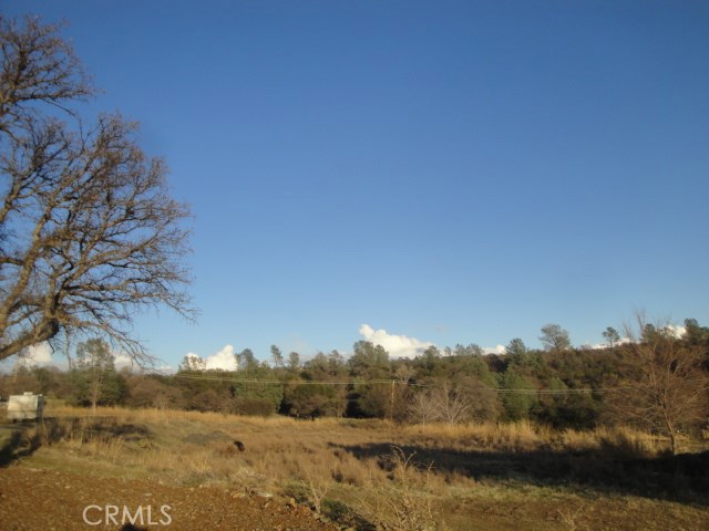 a view of a town with mountains in the background