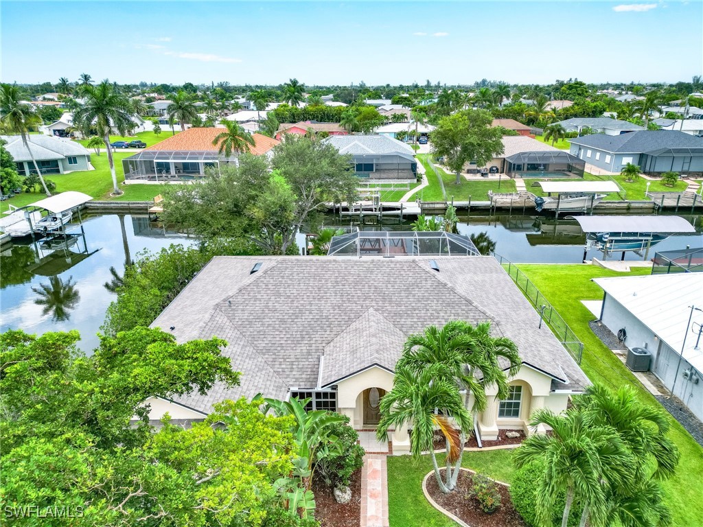 an aerial view of a house with a swimming pool yard and outdoor seating