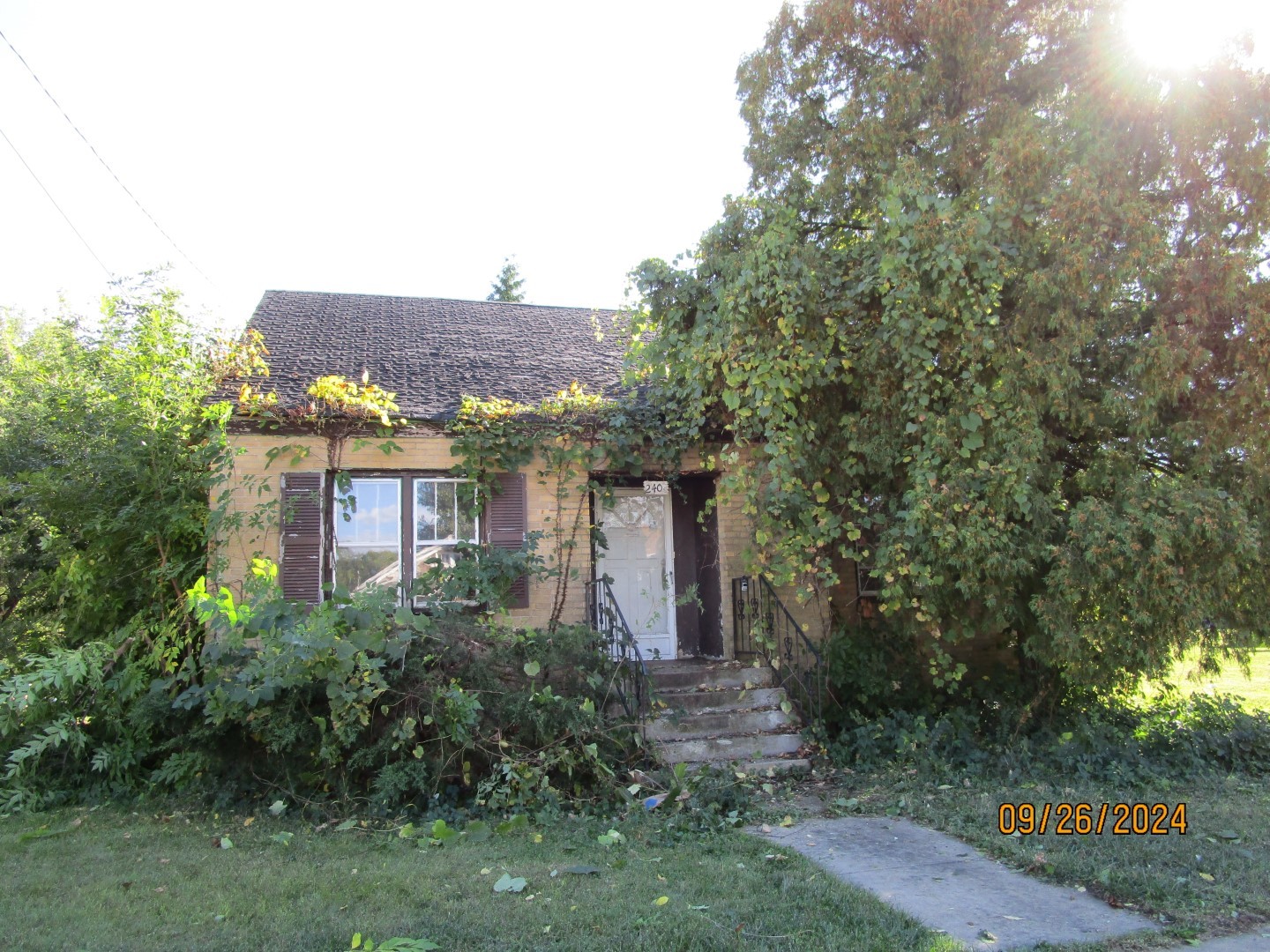 a view of a building with a yard