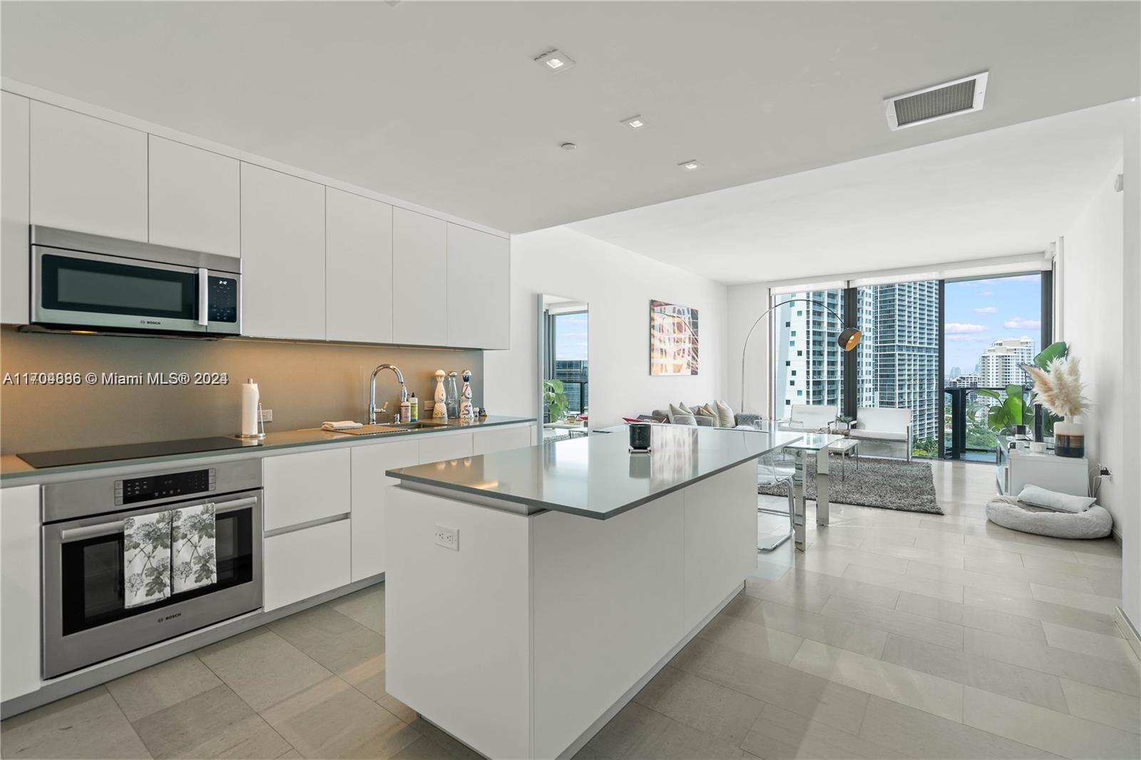 a kitchen with counter top space and appliances