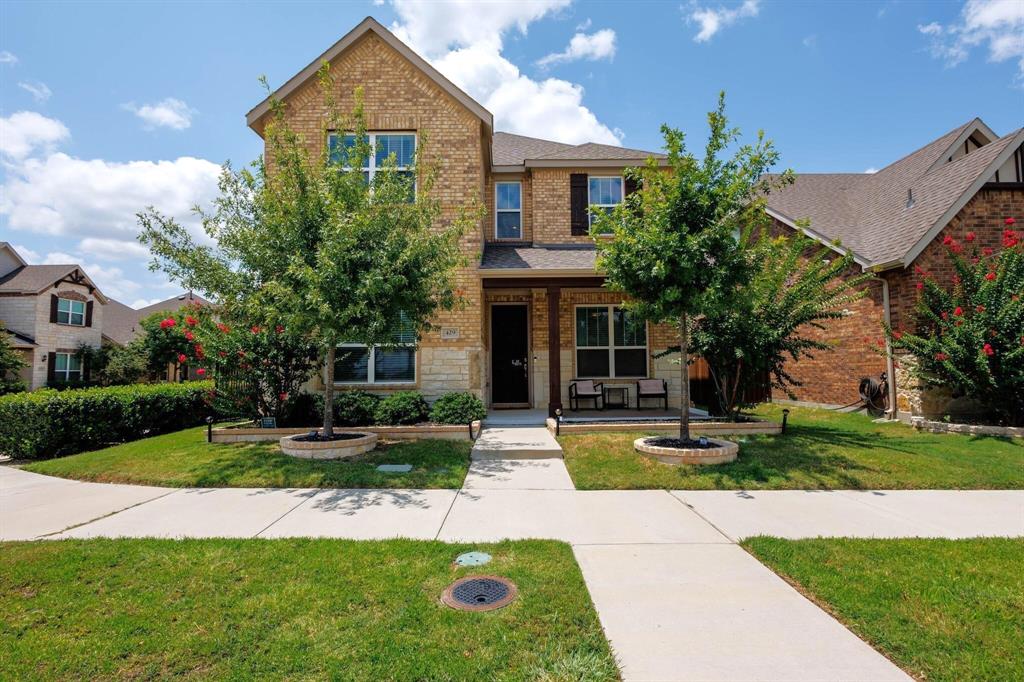 a front view of house with yard and green space