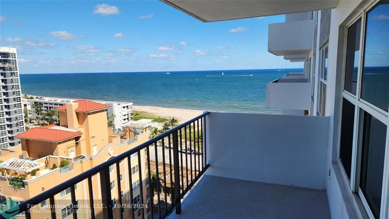 a view of balcony and furniture