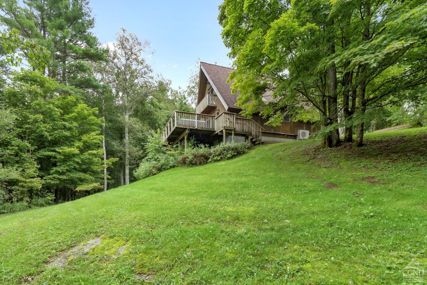 a view of a house with a park