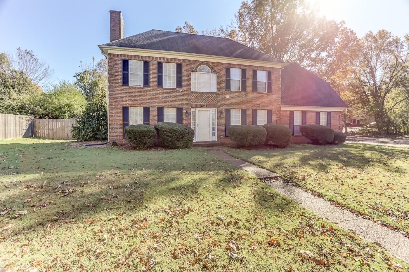 Colonial house featuring a front yard