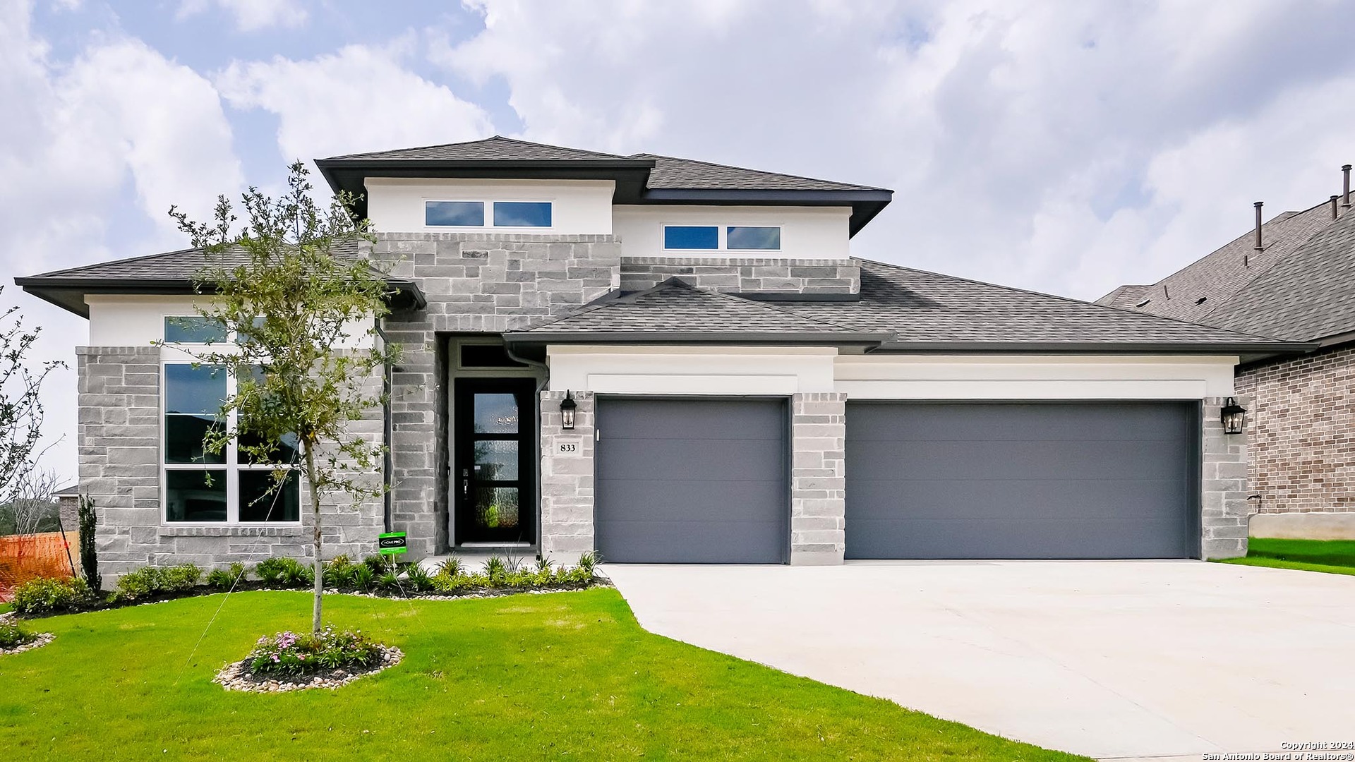 a front view of a house with a yard