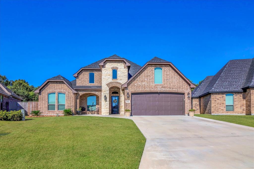 Raised driveway leading to an elegant home