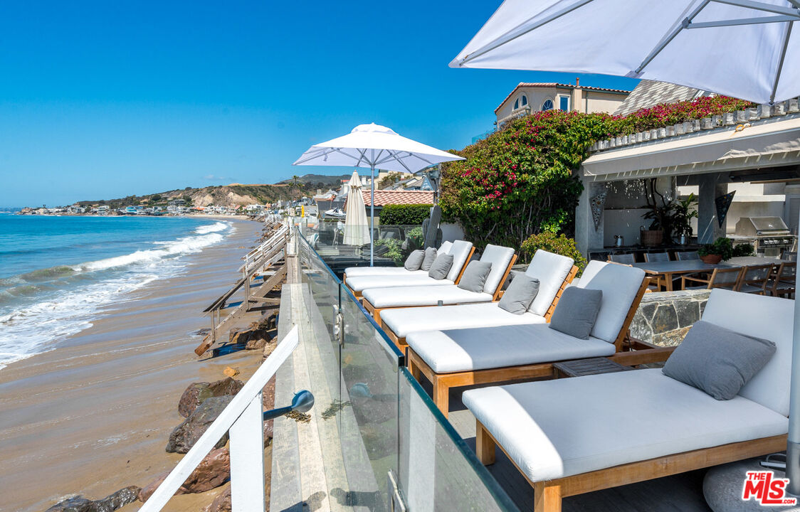 a view of a patio with furniture and a table