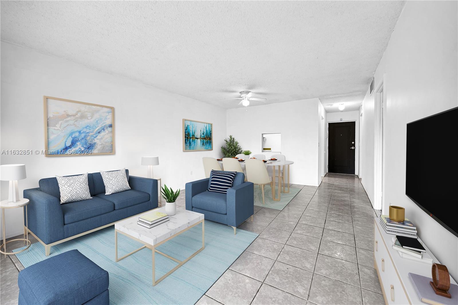 a living room with furniture and a flat screen tv