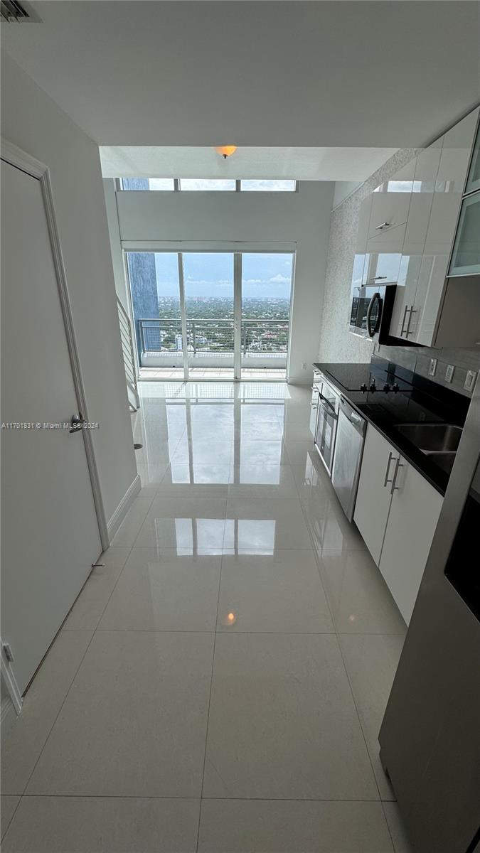 a kitchen with a sink and cabinets