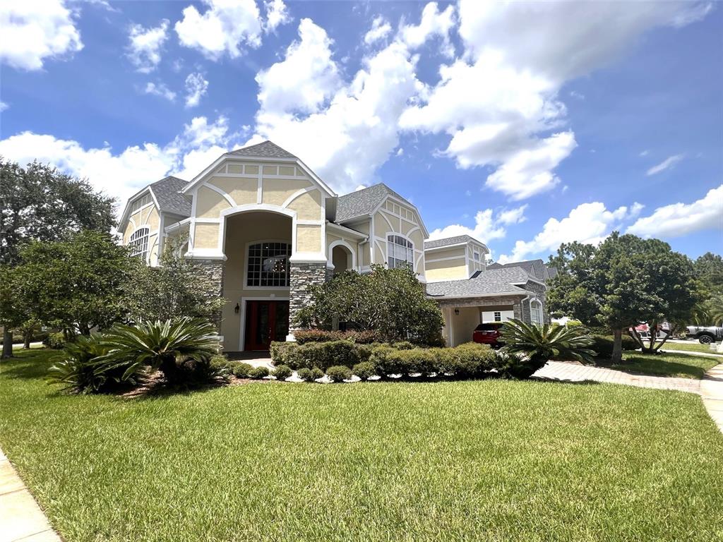 a front view of a house with a yard