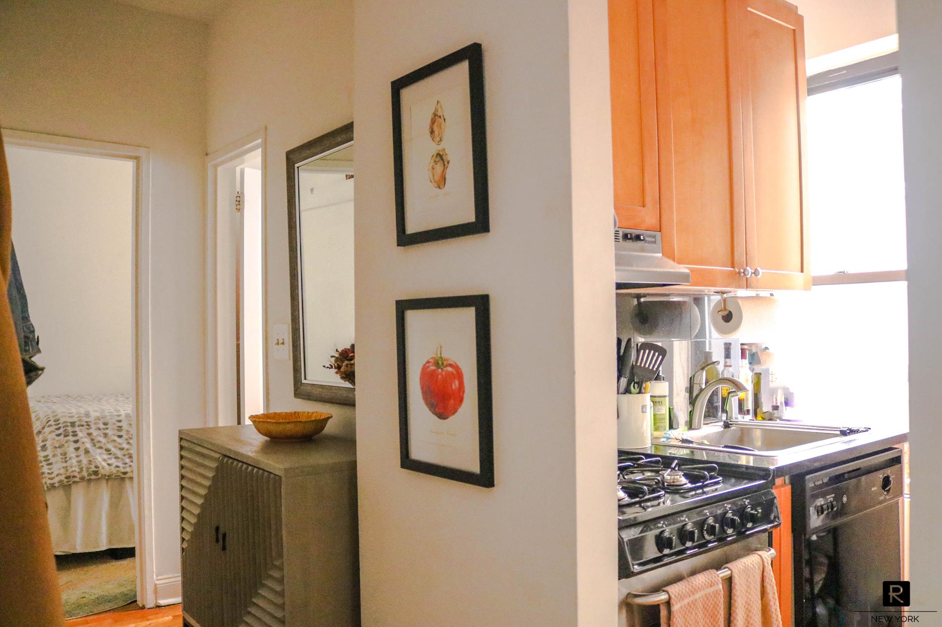 a kitchen with stainless steel appliances granite countertop a stove and a microwave