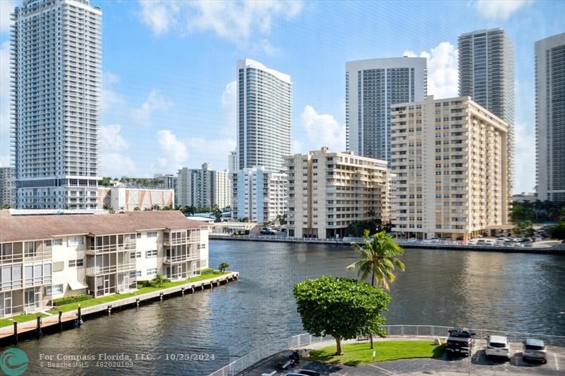 a view of a lake with tall building